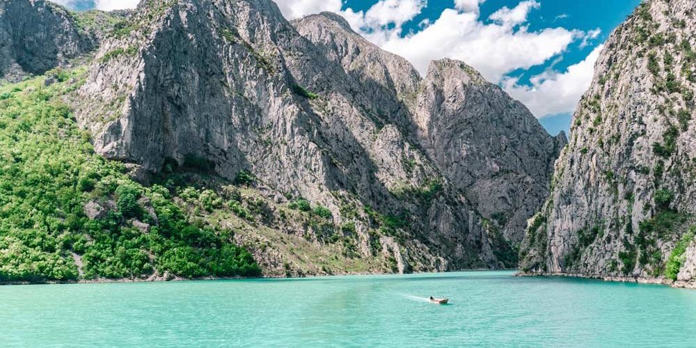 Albania-Komani-Lake-Caribbean-blue-mountains+underrated+countries+to+visit